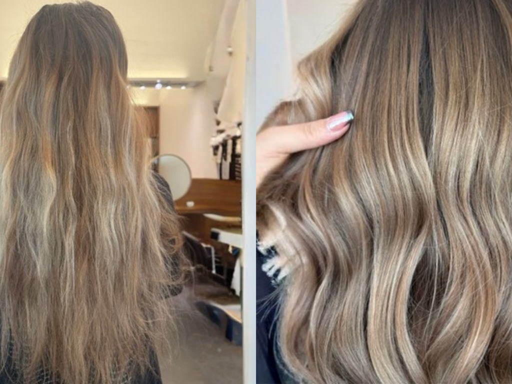 A split-screen before-and-after style comparison showing a person from the back with long, wavy, highlighted hair. The left side shows the full length of the hair in a salon-like interior, while the right side shows a close-up of the hair texture and color, with a hand touching the hair.