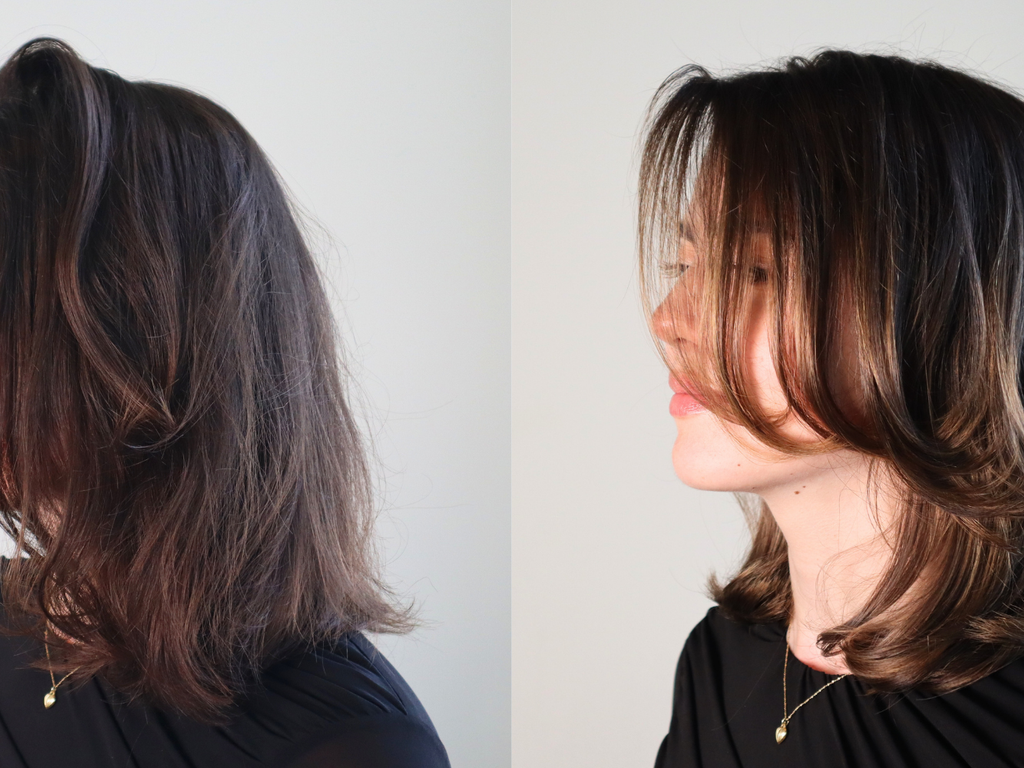 A side-by-side comparison of a woman's shoulder-length layered hairstyle, showing the side profile from the front and a three-quarter side view with her hair swept to the side. The hair is dark brown with warm caramel and honey blonde highlights, and she is wearing a black top against a plain light gray background.