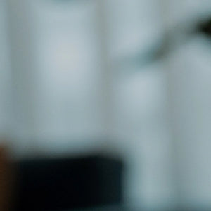 Blurred image of a room with furniture and decor