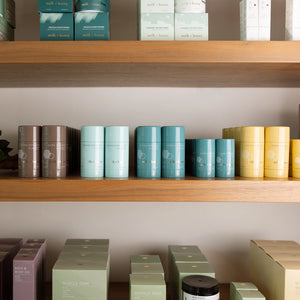 Shelves with various containers and boxes on a neutral background
