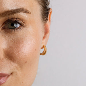 Close-up of a woman's face with a neutral background