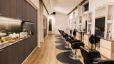 Modern hair salon interior with black chairs and wooden floors